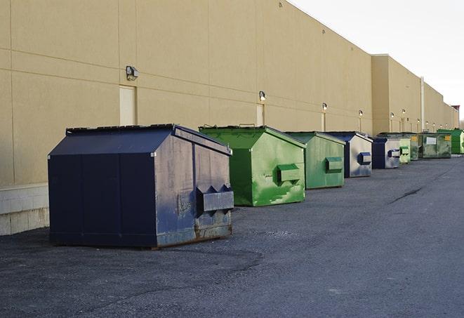 well-organized construction site with dumpsters in place in Brighton, MA